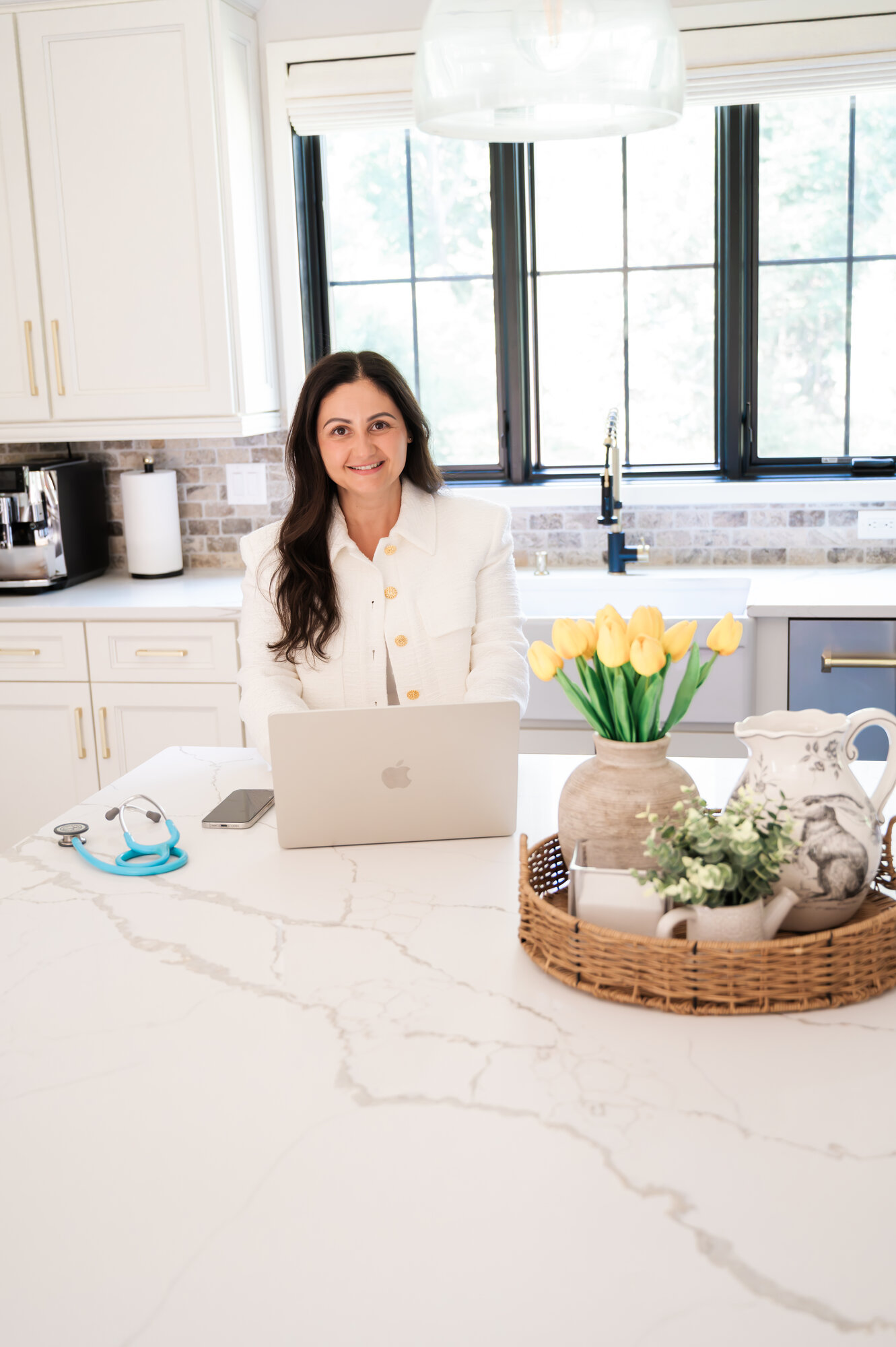 Loreta working at her kitchen island